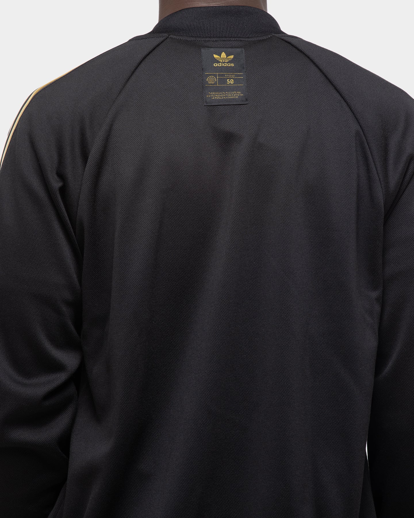 adidas track top black gold