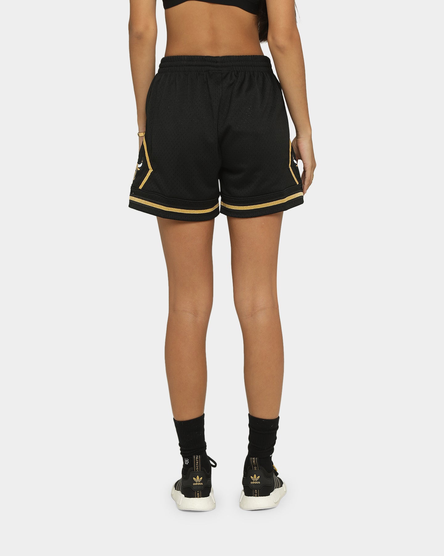 black and university gold shorts