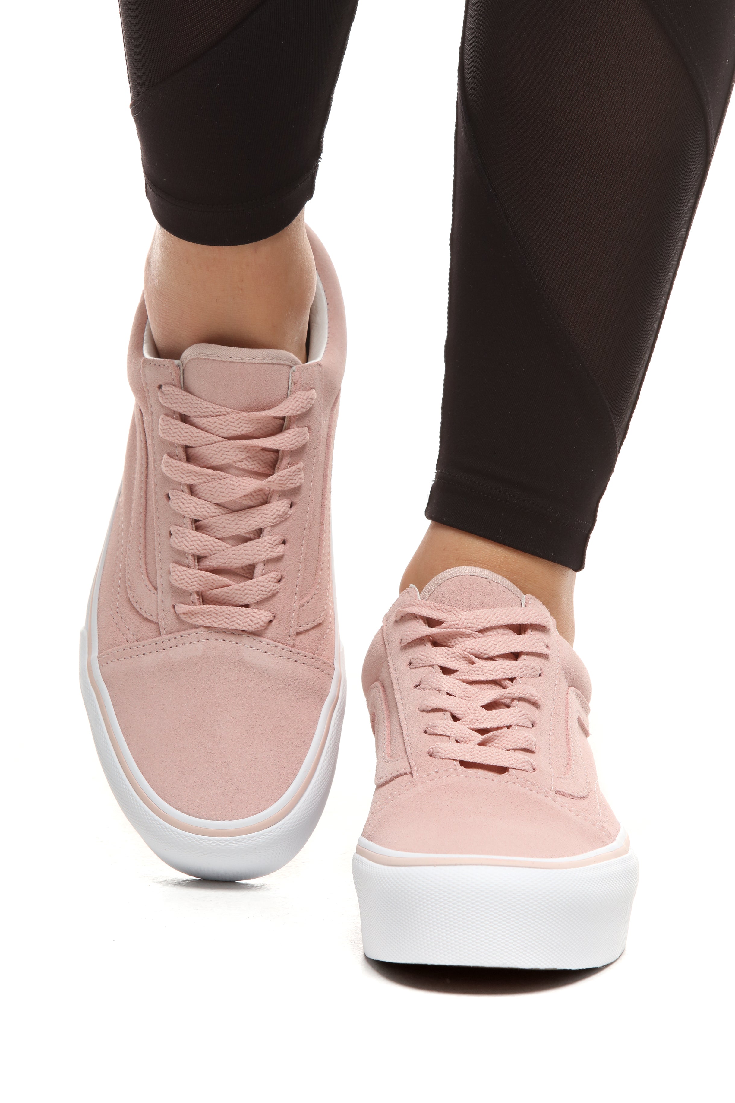 pink and white platform vans