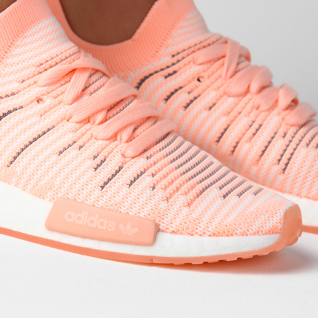 nmd_r1 stlt primeknit shoes clear orange