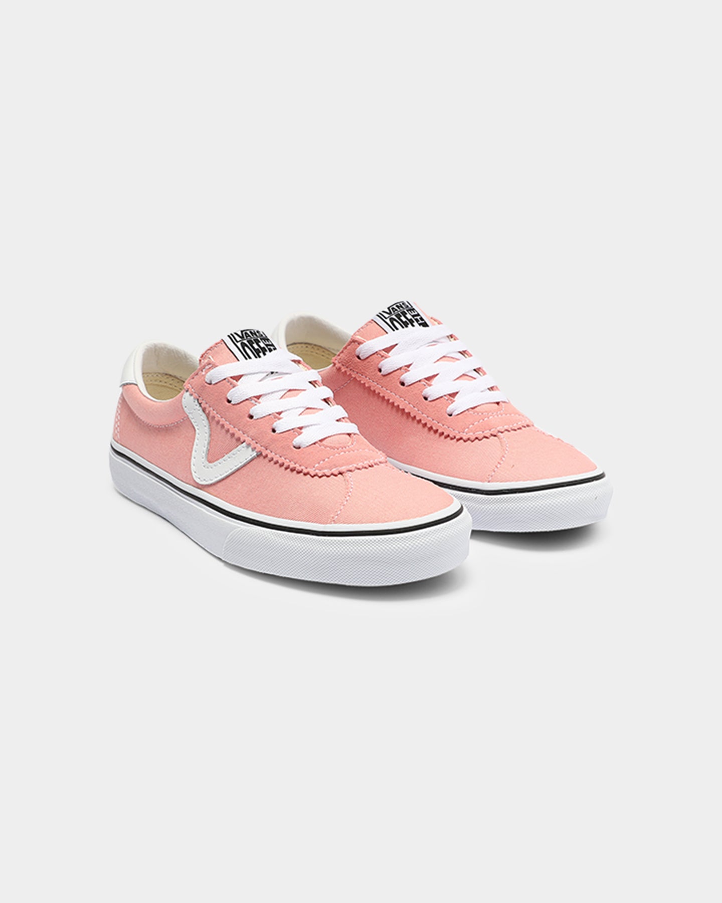 white and pink vans