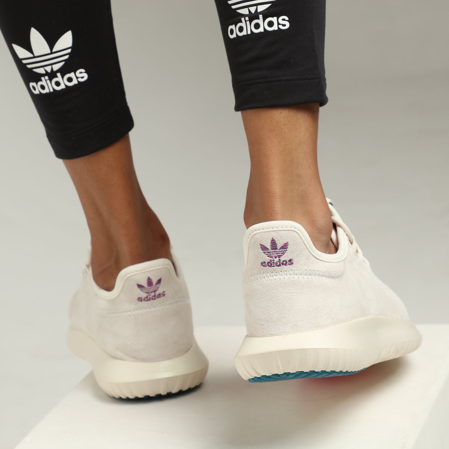 pink and green tubular adidas