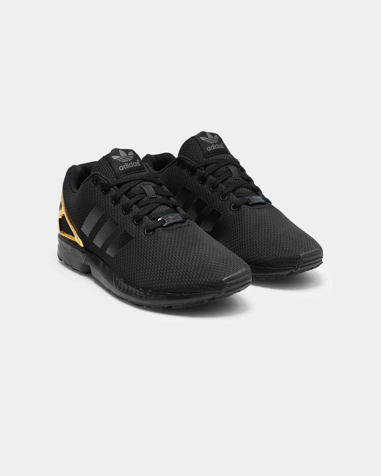 zx flux black and gold