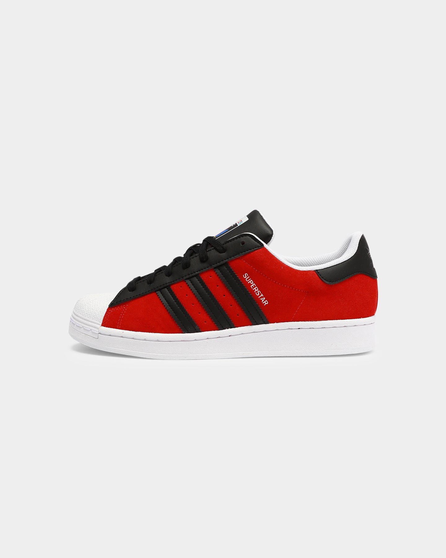 black adidas with red