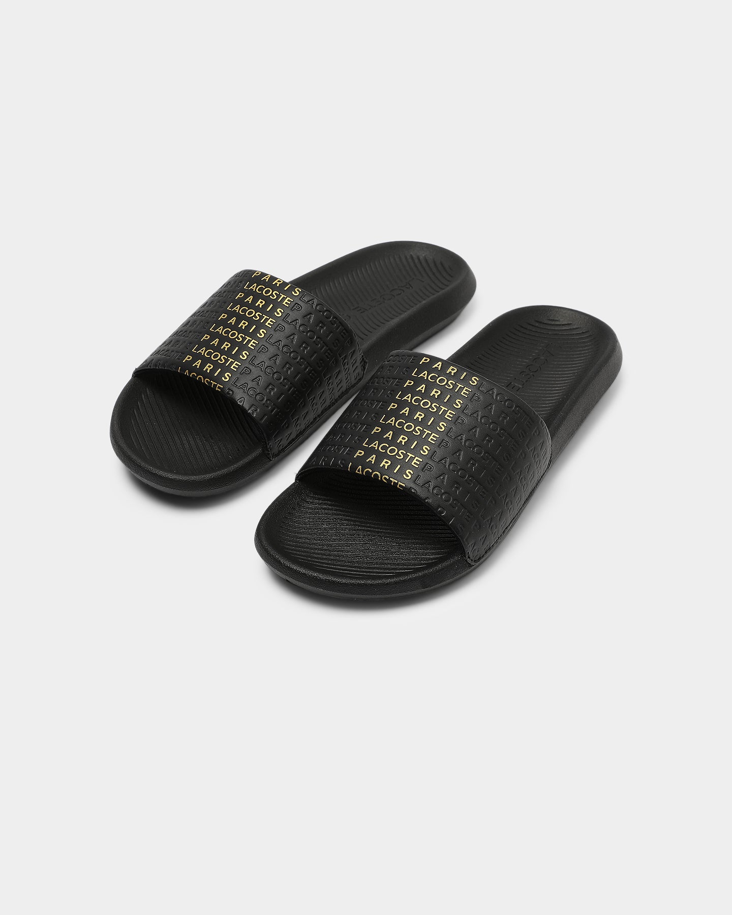 white and gold lacoste slides