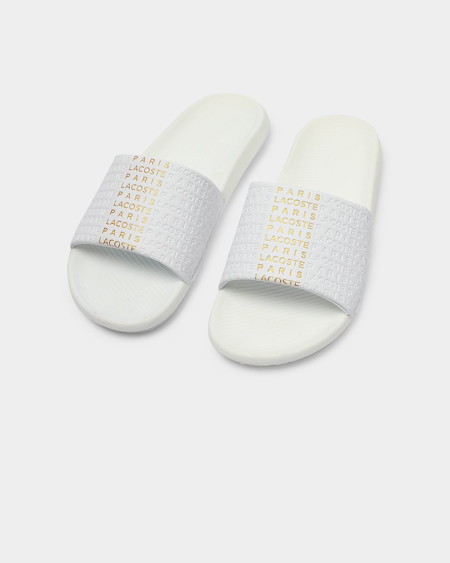 white and gold lacoste slides