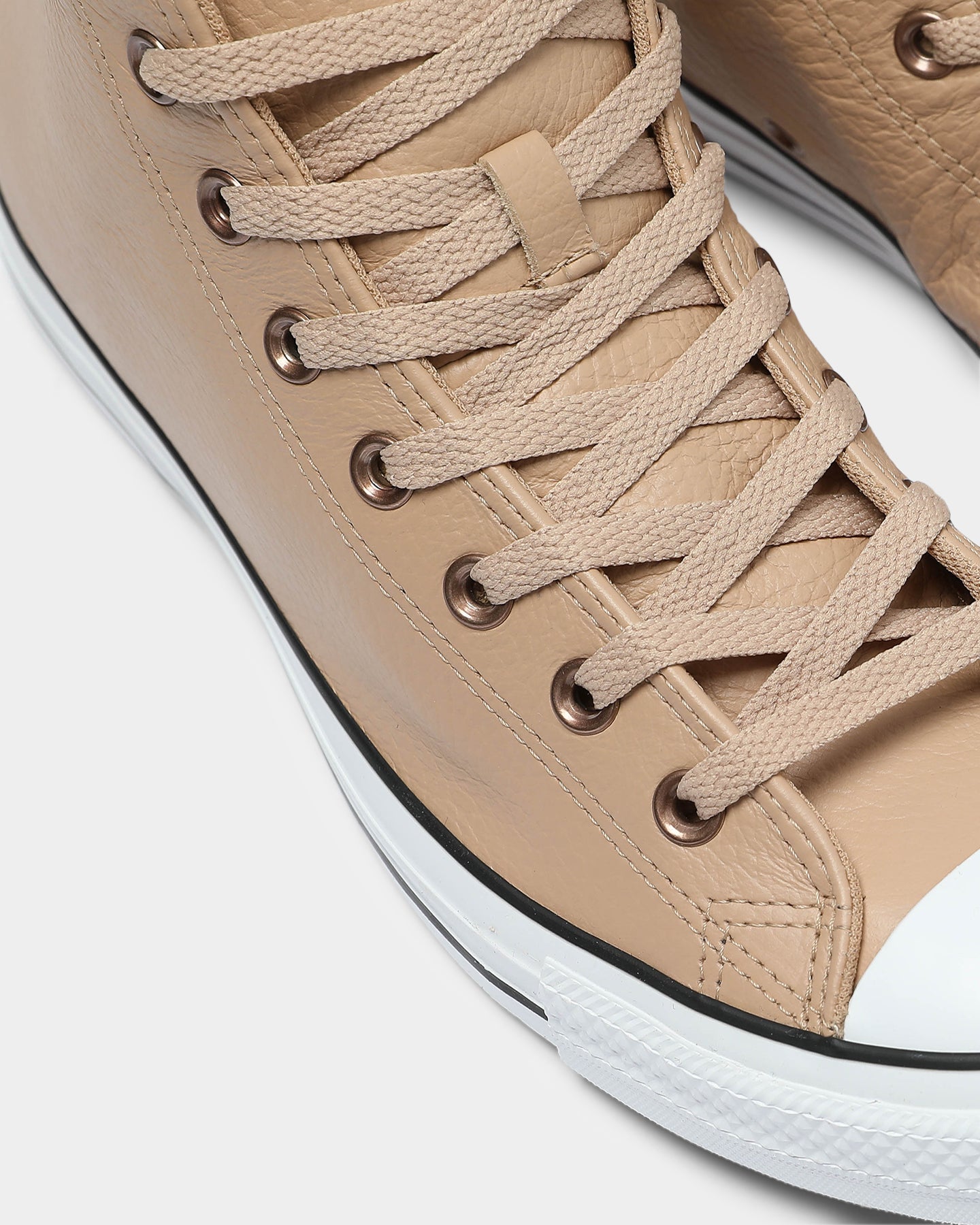 tan leather chuck taylors
